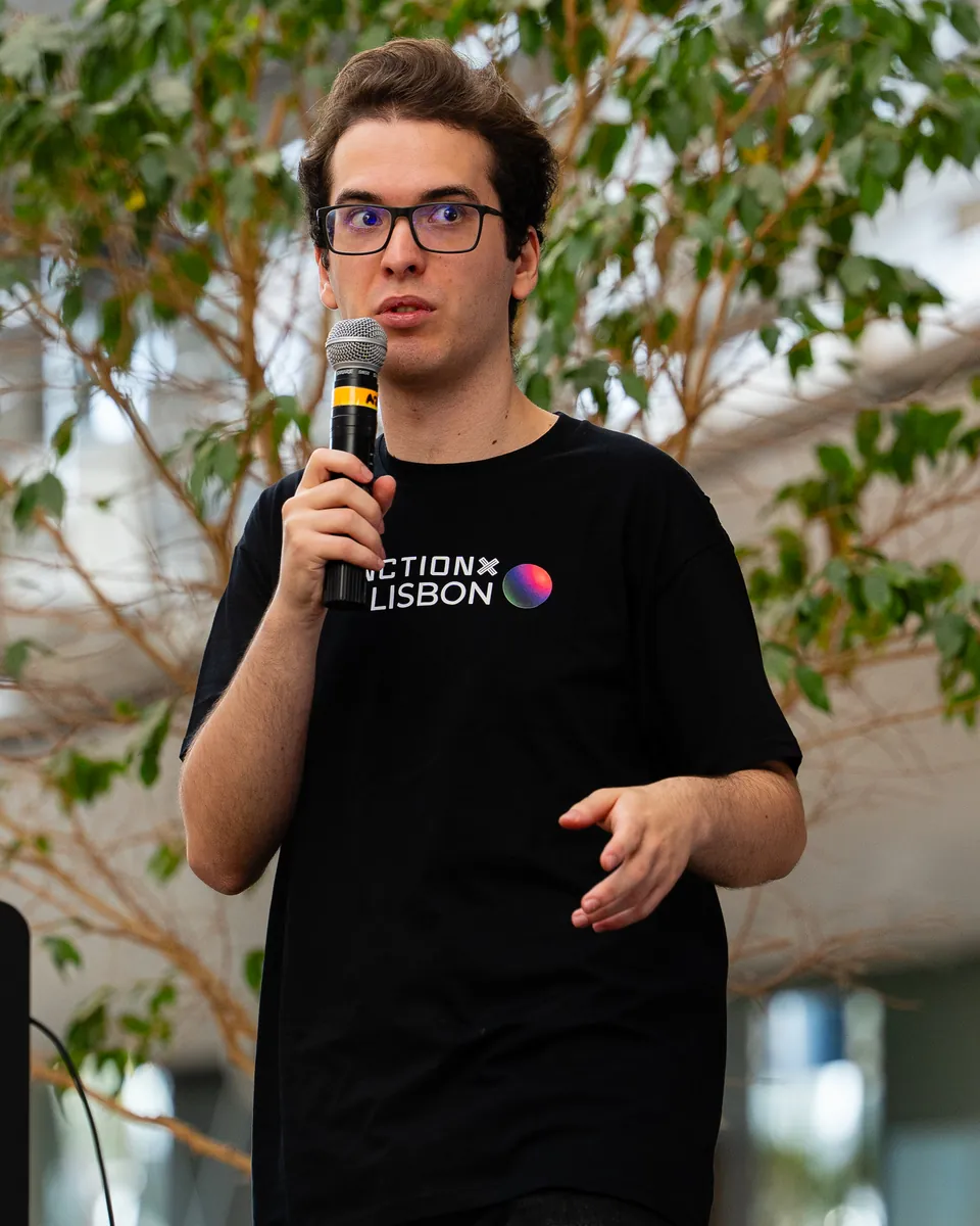 Daniel speaking on stage at JunctionX Lisbon 2026